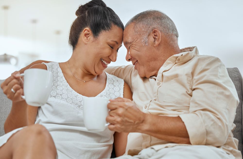 Retired couple smiling and embracing